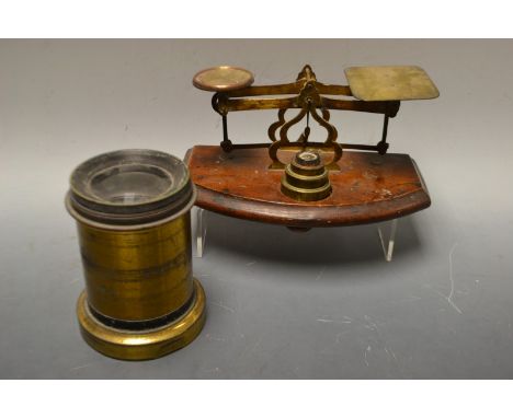 A large brass lens, Busch's Rapid Aplanat No 5, foc 18ins; a pair of   brass and mahogany postal balance scales (2)