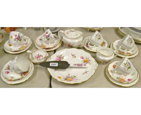 A Royal Crown Derby Posie pattern tea service comprising of cake plate and knife, bachelor tea pot, tea strainer, cups, sauce