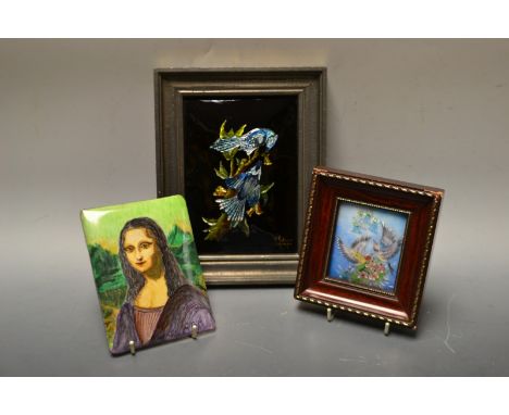 A Limoges enamel plaque, Birds, signed R Restoueix; two other Limoges plaques (3)