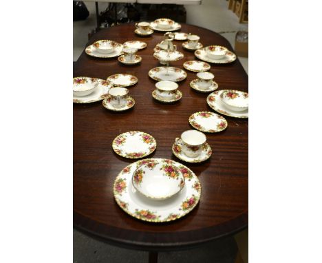 A Royal Albert Old Country Roses dinner and tea service for six, comprising dinner plates, side plates, bowls, cups and sauce