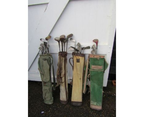 4 Vintage pencil golf bags with clubs