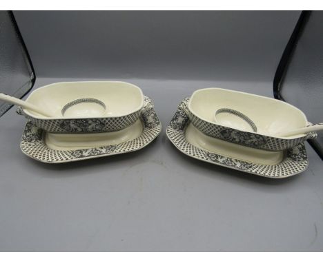 Spode sauce boats on stands with ladles