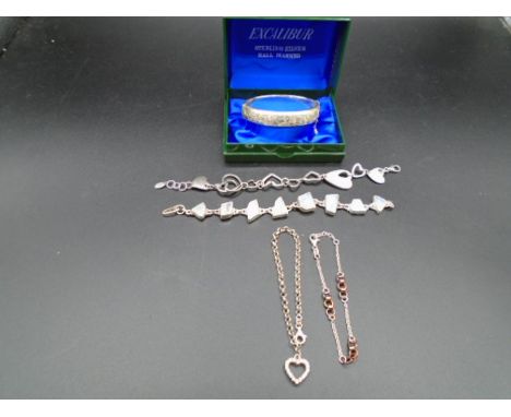 A silver hallmarked - Birmingham 1986 15g hinged bangle with safety chain in presentation box, plus a heart bracelet by Fiore
