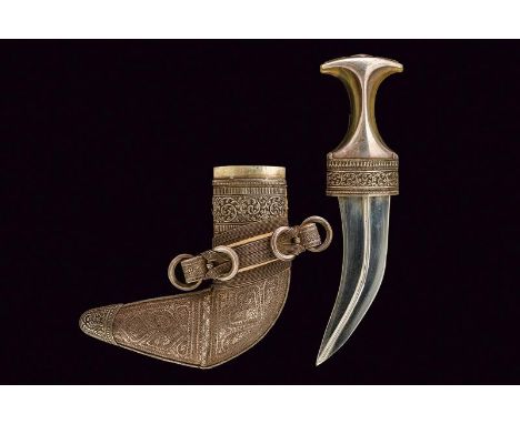dating: circa 1900 provenance: Oman, Curved, double-edged blade, with central raiser; transparent, light-horn grip with silve