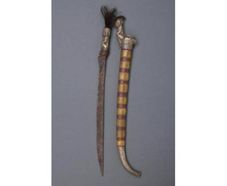 dating: 20th Century provenance: Sumatra, Simple, slightly curved, single-edged blade; white metal grip shaped as a indigenou