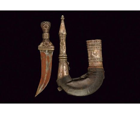 dating: 19th Century provenance: Yemen, Curved, double-edged blade, with central raiser, horn grip with silver mounts, adorne