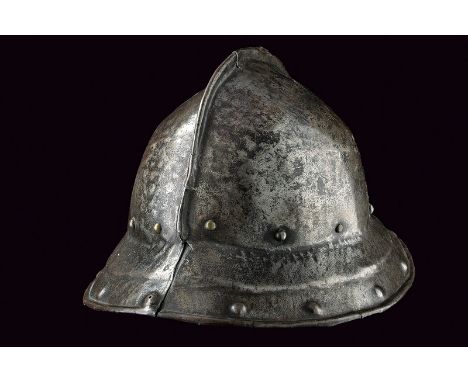 dating: 17th Century provenance: England, Iron helmet in two parts, with sloping brim, recessed margin and hemmed border, sho