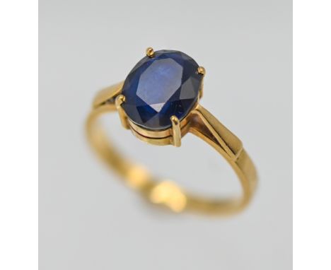 A sapphire single stone ring, centre oval brilliant cut Sapphire (Sri Lanka) with a dark hue, claw set in yellow gold, stampe