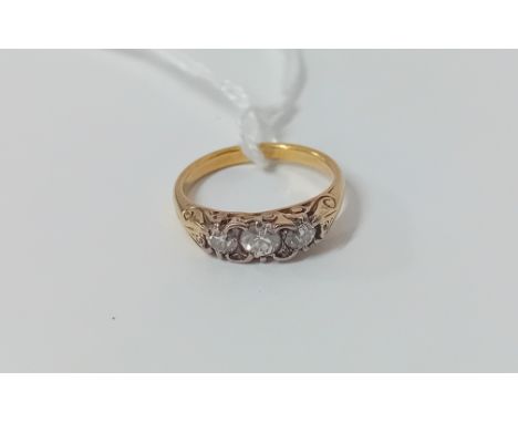 A yellow gold three stone diamond ring (unmarked), size K.