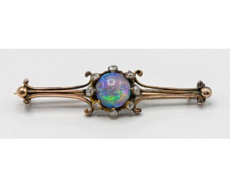 A black opal and diamond set brooch (not hallmarked), approx 4.7g.