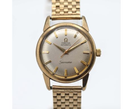 Omega, a gents automatic Seamaster wristwatch set in 9ct yellow gold, brick style bracelet, silver gold baton dial, Circa 195