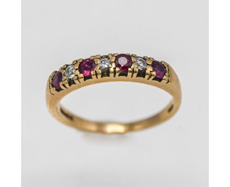 A 9ct yellow gold diamond and ruby seven stone ring, approx 2.3g, size M.