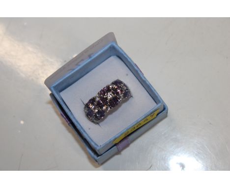 A large Sterling silver amethyst and cubic zirconia set dress ring, ring size O/P, 6.5gms 