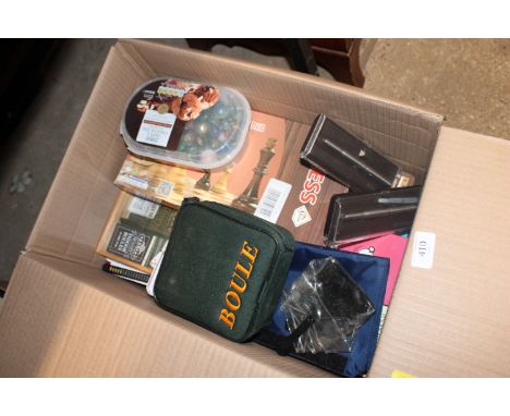 A box of various games to include Boule, chess, various marbles etc. 