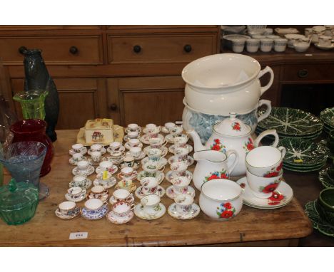 A quantity of miniature cups and saucers to include Royal Albert 'Flowers Of The Month', Coalport, Crown Staffs, 'Masons etc.