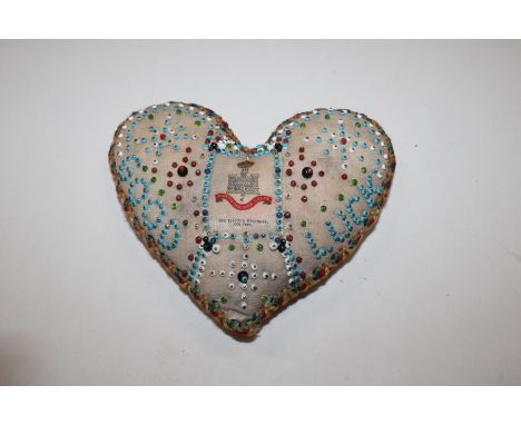 An early 20th Century Suffolk Regiment sweetheart cushion 12th Foot with beads and Good Luck