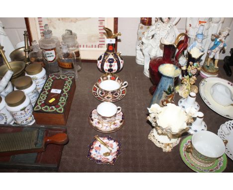 A Royal Crown Derby baluster ewer decorated in the Imari pattern, handle neck and base richly decorated in gilt AF; a Royal C