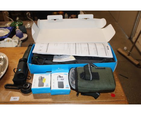 A telephoto lens set with tripod for a smart phone and various spotting scopes 