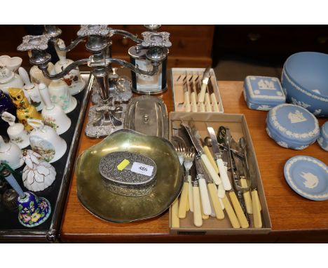 A pair of silver plated candelabra, flatware, silver plated trinket box etc.