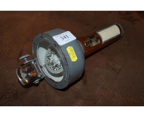 A WWII Royal Navy hand held compass