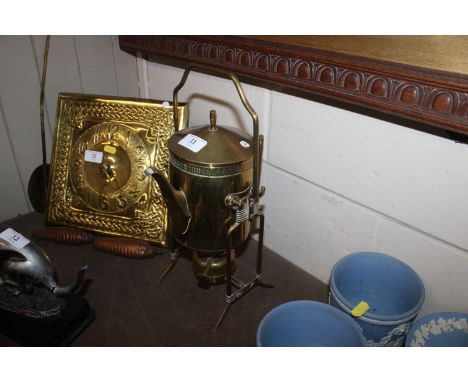An early 20th Century Jungendstil brass spirit kettle on stand, raised on splayed feet 