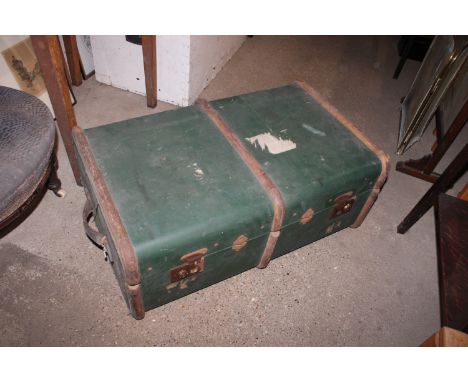 A wooden and metal bound traveling trunk&nbsp;