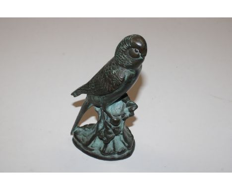A mid-20th Century bronze Verdigris budgerigar perched on a tree trunk