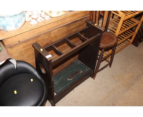 An early 20th Century oak stick stand 