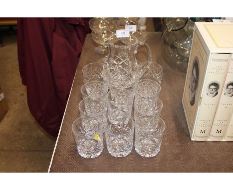 A quantity of cut glass table glassware to include Royal Doulton jug, glasses marked S to base etc. 