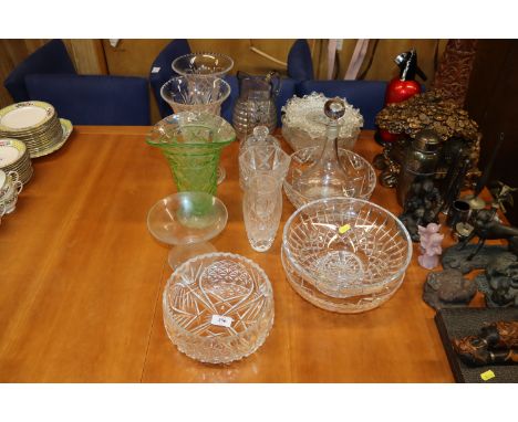 A quantity of various table glassware to include a pair of cut glass vases, decanter and stopper, various bowls 