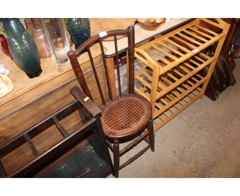 An antique child's cane seated and stick back chair