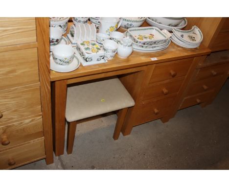 A modern dressing table fitted three drawers and upholstered stool