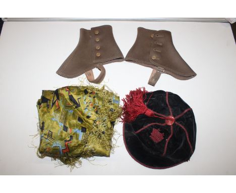 A silk scarf, a pair of spats and a school cap