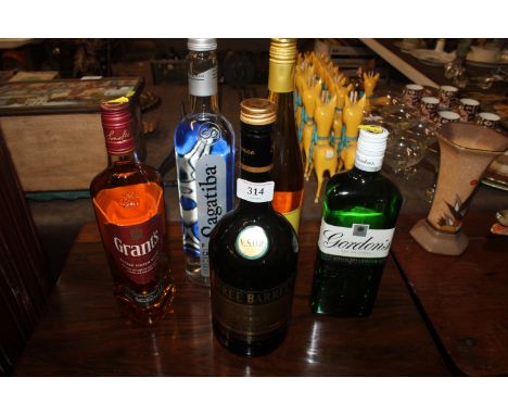A bottle of Grants Triple Wood blended Scotch whisky; a bottle of Sagatiba; a bottle of Gordon's gin and a bottle of Three Ba