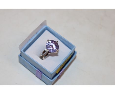 A large Sterling silver and amethyst solitaire ring, ring size L/M