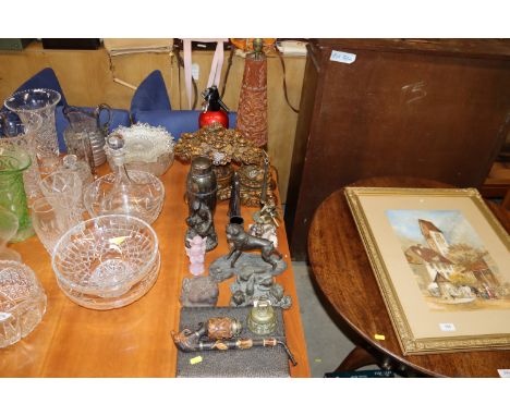 A quantity of various ornaments to include a carved wooden mask in the form of a monkeys head, bronzed figures, carved wooden