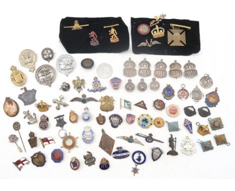 A mixed collection of military and civilian badges, to include five hallmarked silver ARP lapel/pin badges, three silver Roya