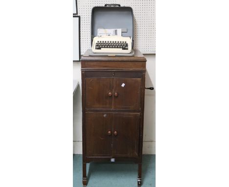 A 20th century mahogany cased "His Masters Voice" model 162 gramophone, 103cm high x 47cm wide x 52cm deep and a Remington "t