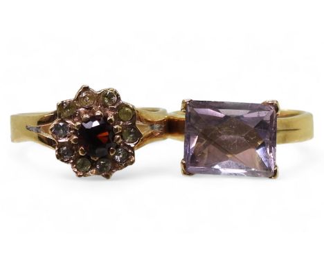 A yellow metal ring set with a fancy cut amethyst, size K, together with a garnet and clear gem set ring, size m, weight comb