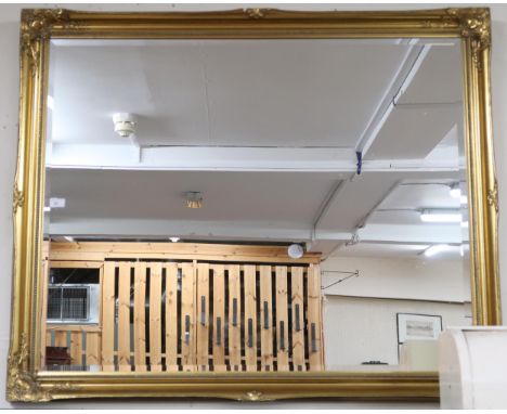 A large 20th century gilt framed bevelled glass wall mirror, 106cm high x 128cm wide Condition Report:Available upon request