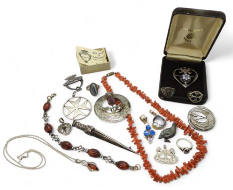 A collection of Scotish silver items to include items by Ola Gorie, Iona silver, a Heart of Midlothian Luckenbooth, Caithness