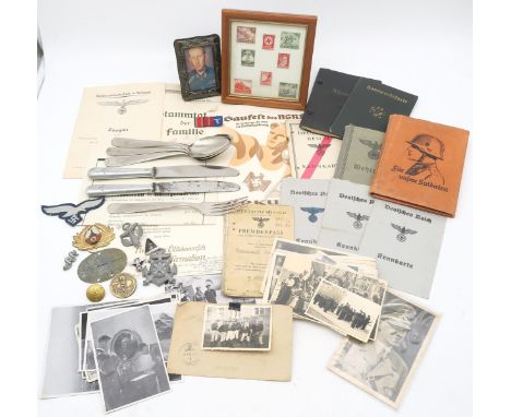 A collection of items relating to the German Third Reich, comprising a Waffen-SS Panzer dog tag; assorted flatware bearing Lu