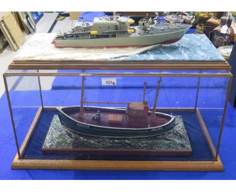 A model fishing boat named Anne, AH. 153, housed in a glass case measuring approx. 65cm x 35cm x 31cm; together with four fur