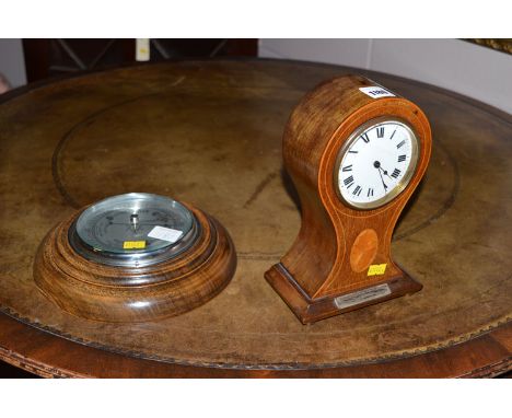 An Edwardian mantel clock in inlaid mahogany case; together with a barometer.