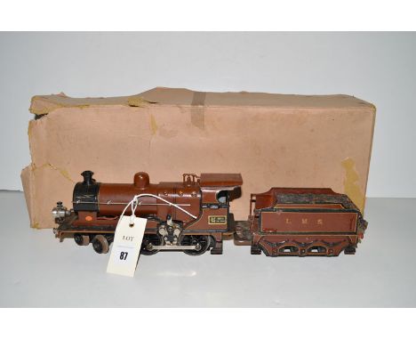 A Marklin tinplate electric locomotive, 4-4-0, with tender, in associated box.
