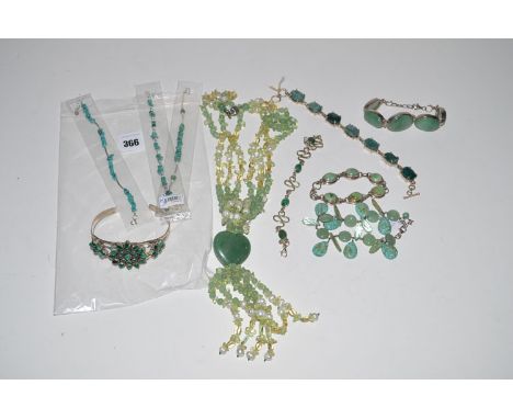 A quantity of green stone set bracelets, including: malachite, jade and turquoise.