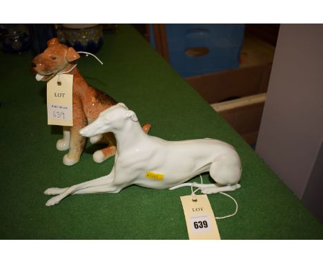 A white Austrian porcelain figure of a greyhound; together with a ceramic Welsh terrier. (2)