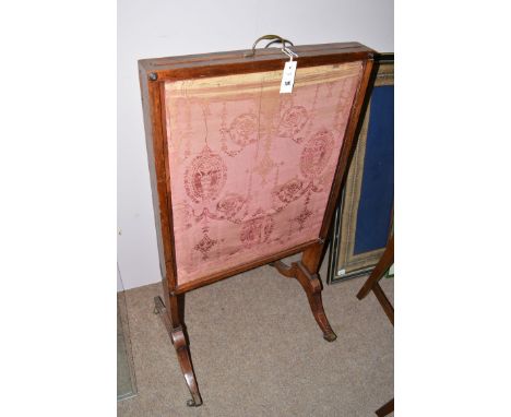 *19th Century mahogany firescreen, with lifting and sliding tapestry panels, raised on splay feet terminating in brass castor