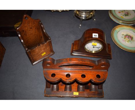 A small mantel clock with white enamel dial and French movement, in inlaid arched mahogany case; a carved and stained wood pi