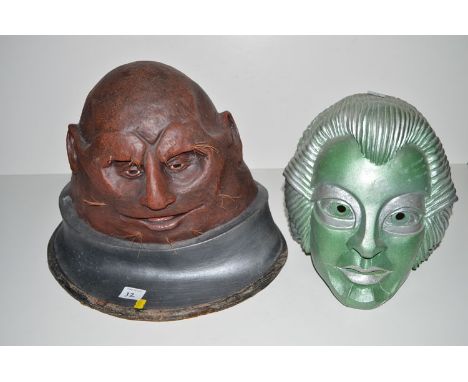 A mask of Voc Robot; and a latex mask of Sontan.